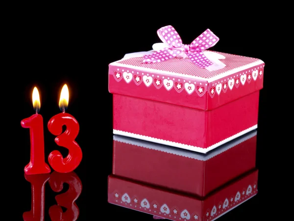 Birthday-anniversary gift with red candles showing Nr. 13 — Stock Photo, Image