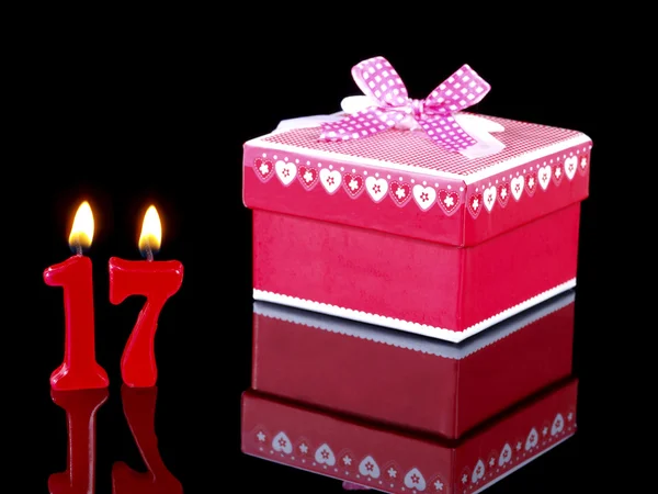 Birthday-anniversary gift with red candles showing Nr. 17 — Stock Photo, Image