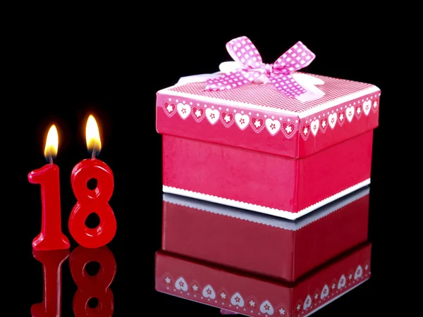 Birthday-anniversary gift with red candles showing Nr. 18 — Stock Photo, Image