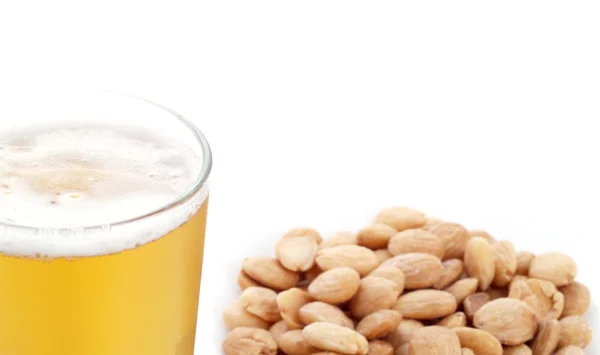 Appetizer with beer and fried, peeled almonds. Stock Photo