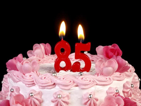 Bursdagskake med røde lys som viser nr. 85 – stockfoto