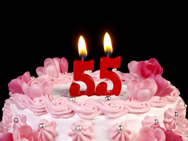 Narozeninový dort s červenými svíčkami ukazující nr. 55 — Stock fotografie