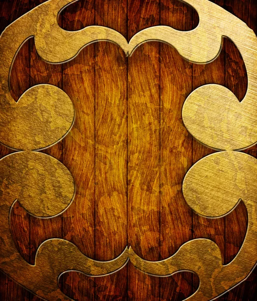 Metalen ornament op bruin houten planken — Stockfoto