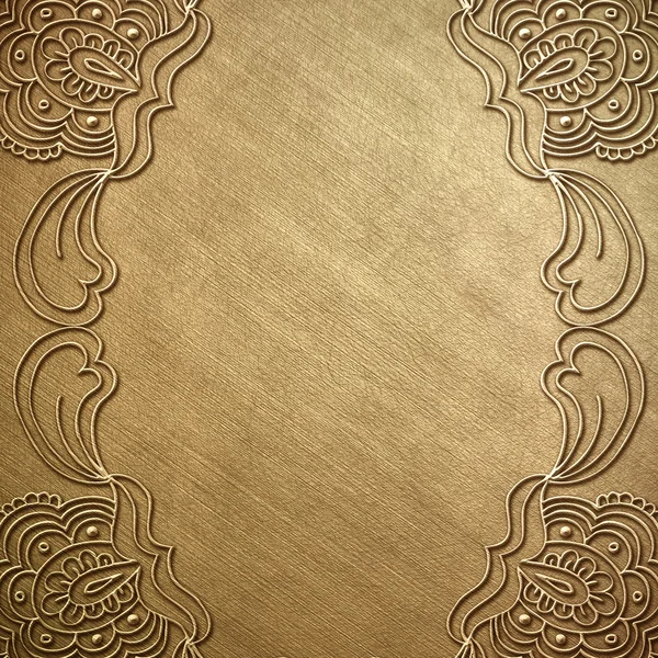 Zlatá kovová deska s ornamenty — Stock fotografie