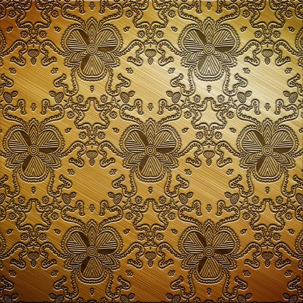 Золотая металлическая пластина с орнаментом — стоковое фото