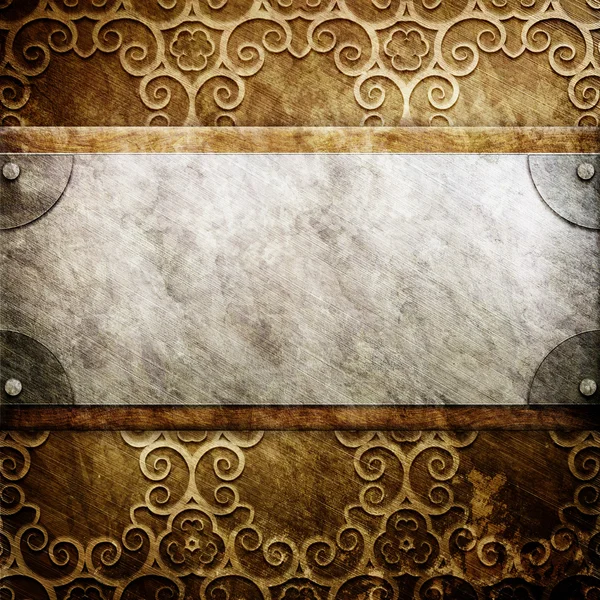 Metal plate on ornate golden wall — Stock Photo, Image