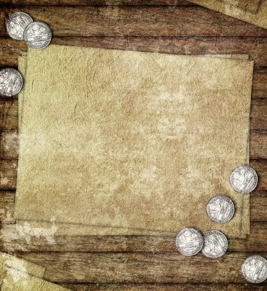 Old paper and silver coins on wooden table — Stock Photo, Image