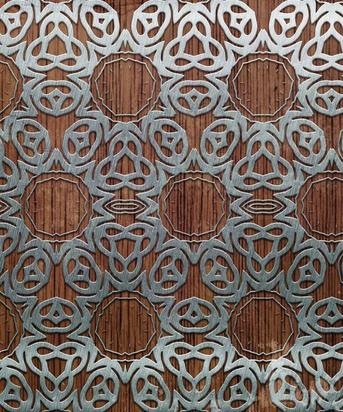 Металлический орнамент на деревянном фоне — стоковое фото