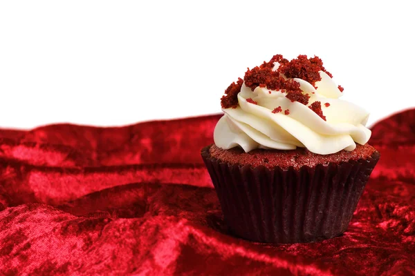 Red Velvet Cupcake sulla texture di velluto Fotografia Stock