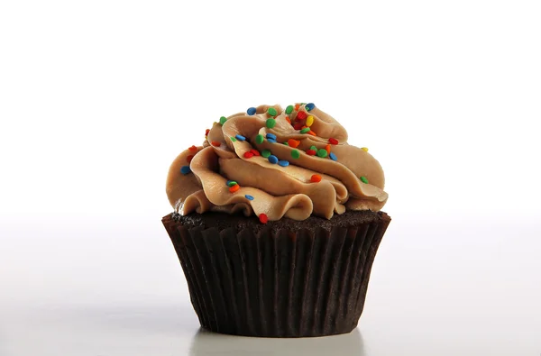 チョコレートのカップケーキに振りかける ロイヤリティフリーのストック画像