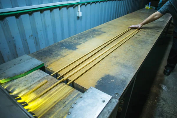 Hardwood Sticks Entering Lacquering Machine — Stock Photo, Image