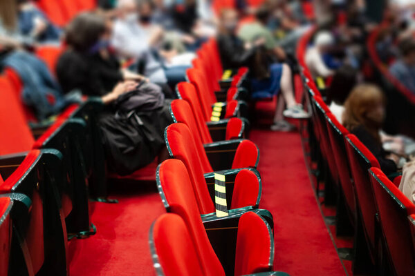 audience at the theater watching a play