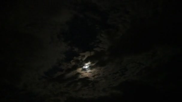 Full Moon Passing Between Clouds — Stock Video