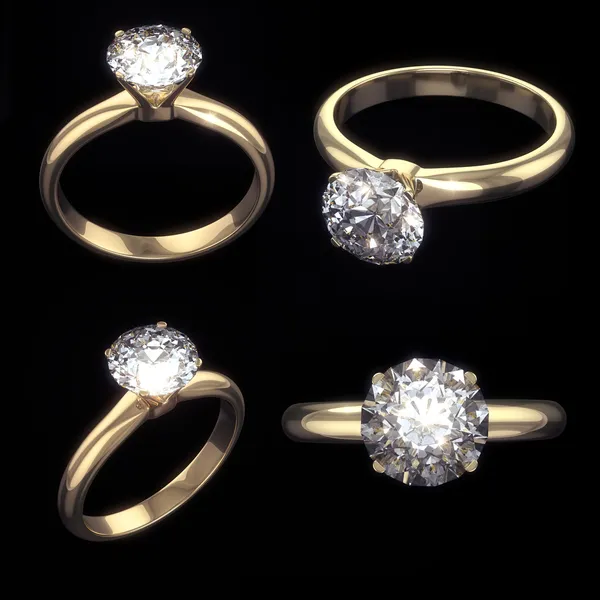 Set of golden diamond rings with clipping path — Stock Photo, Image