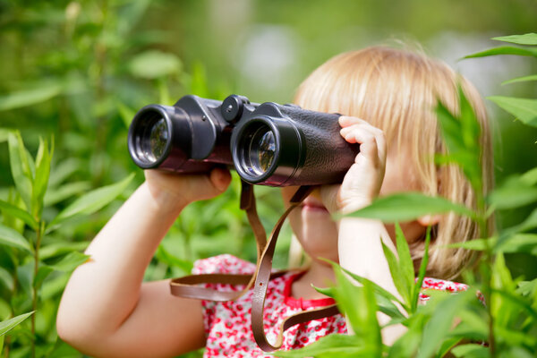 Little girl with binocular