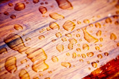 Rain drops on a sealed wood clipart