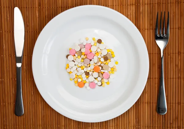 Plate with pills — Stock Photo, Image