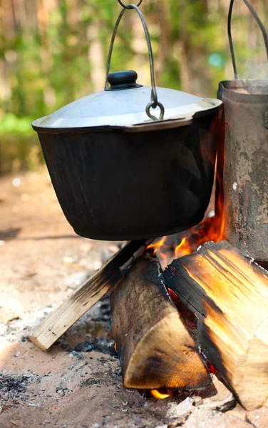 Kettles over campfire — Stock Photo, Image