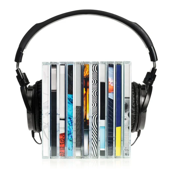 Headphones on stack of CDs — Stock Photo, Image