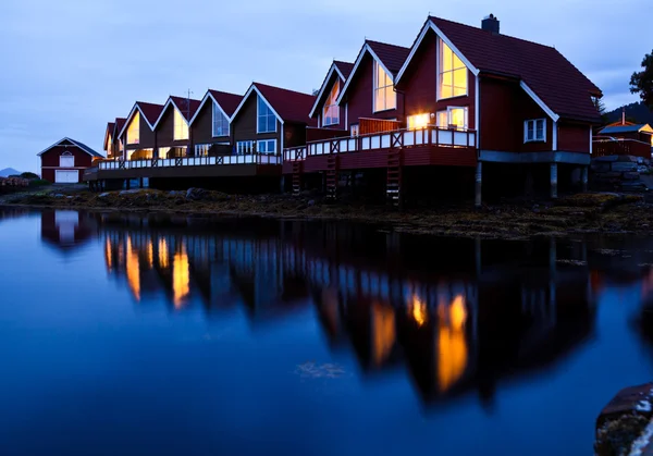 Camping cabins on a fjord at night — Stock Photo, Image