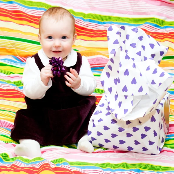 Happy infant with gift — Stock Photo, Image