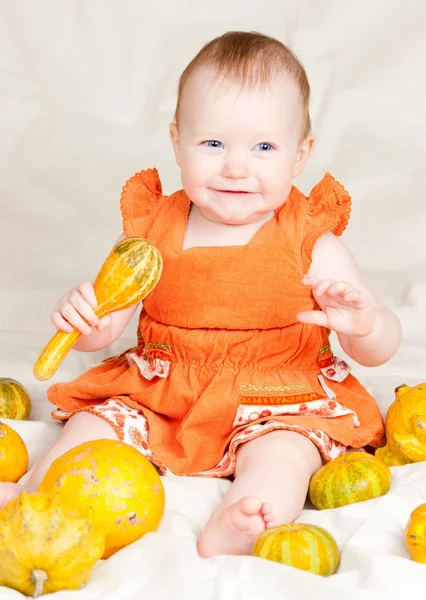 Infant with pumpkins — Stock Photo, Image