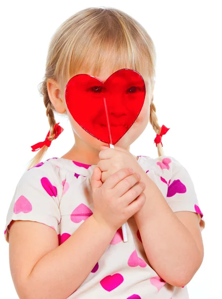 Child looking through lollypop — Stock Photo, Image