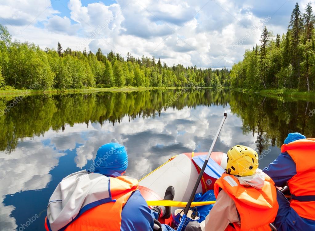 Rafters in rafting boat