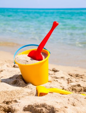 Pail and shovel on beach clipart