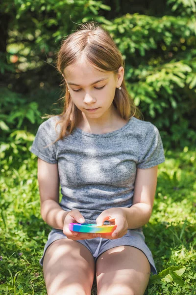 Preteen Girl Playing Silicone Antistress Popit Fidget Toy Outdoors Focus — Stock Photo, Image