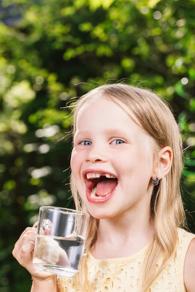 Happy Little Girl Wearing Yellow Dress Holding Glass Cup Water Stock Photo