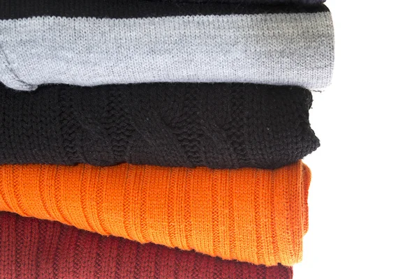 Stos swetry na białym tle — Zdjęcie stockowe