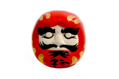 Beyaz arka plan ile izole daruma bebek