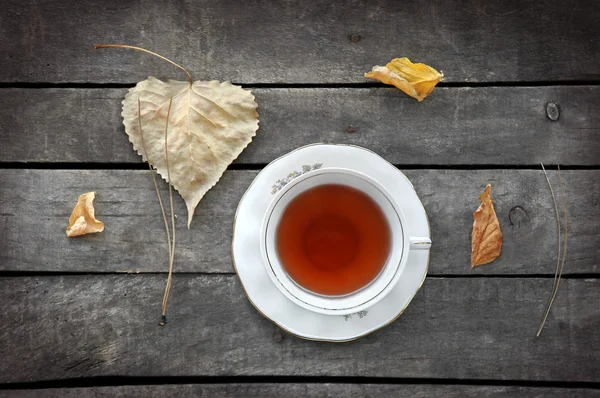 Autumn tea for two in vintage white cups on wood — Stock Photo, Image