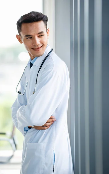 Cheerful Young Cute Asian Male Doctor Uniform Stethoscope Standing Clinic — Stock Photo, Image