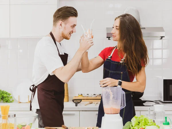 Positive Couple Aprons Happy Together Making Refreshing Smoothie Blender Table — Stock Photo, Image