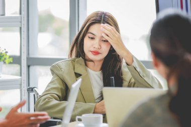 Closeup shot of Asian pretty happy cheerful  female businesswoman intern trainee in casual suit sitting smiling f in company office