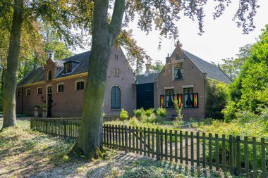 Some outbuildings with beautiful shutters on the windows in a park in Lisse, the Netherlands