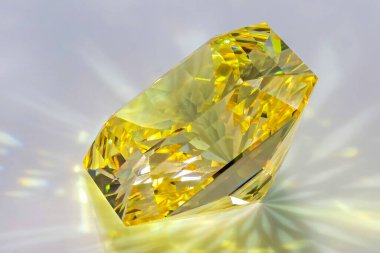 Detail photo (focus stacking) of a self-cut Cubic Zirconia with Lemon color and Squartuguese cut, placed on a white acrylic glass surface with the crown facing top left
