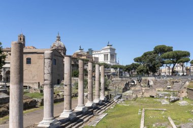 View of the excavations next to Basilica Emilia with Altar of the Fatherland in Rome in the background