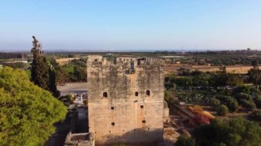 Aerial drone close up footage of the medieval castle of Kolossi, situated in the south of Cyprus, in Limassol with sea view from above. Castle dates back to the crusades and it is a historic landmark