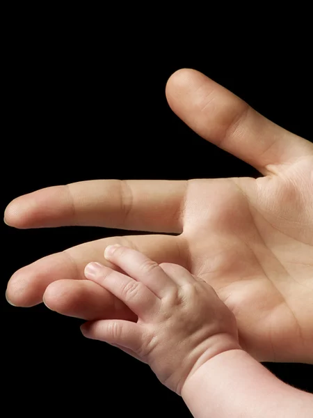 Felnőtt- és a kis kezét — Stock Fotó