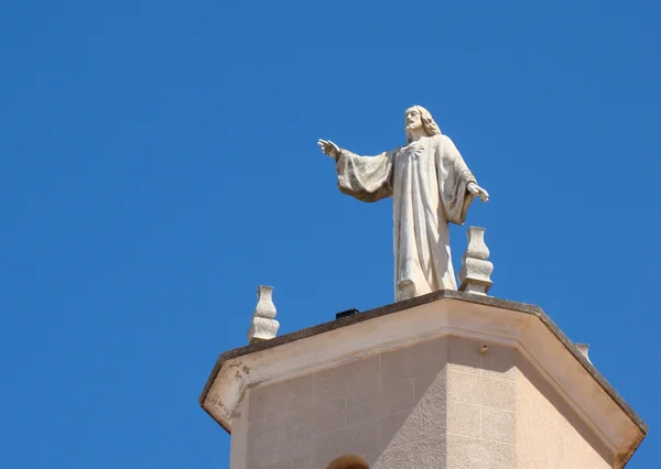 Statue of Jesus on the church tower, Ciutadella — Stock Photo, Image