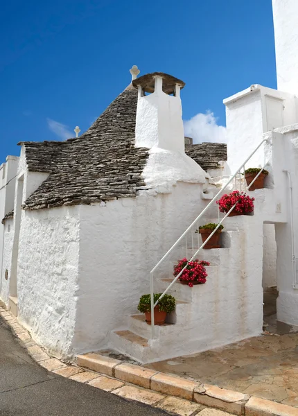 Trulli no sul da cidade italiana de Alberobello Fotografia De Stock