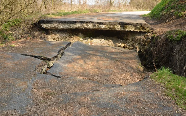 Destroyed asphalt road Stock Photo