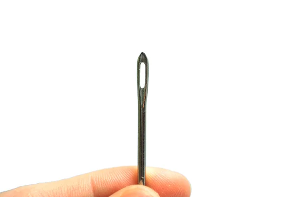 Hand holding a Sewing needle — Stock Photo, Image