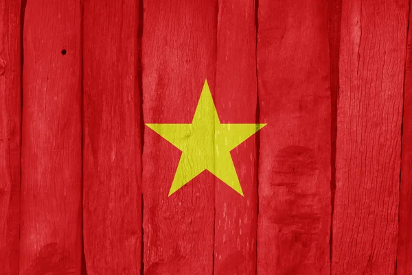 Wooden fence with the flag of Vietnam painted on it — Stock Photo, Image