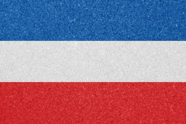 The flag of Yugoslavia painted on a cork board — Stock Photo, Image