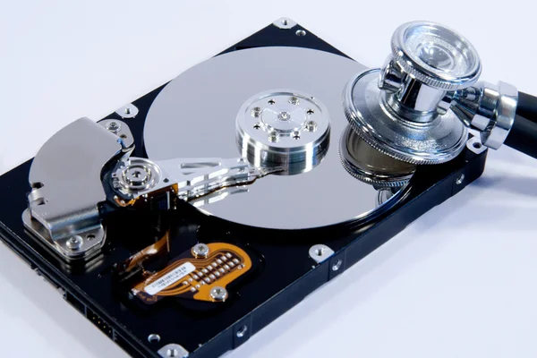 Examine computer hard drive with stethoscope — Φωτογραφία Αρχείου