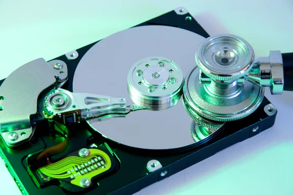 Examine computer hard drive with stethoscope — Φωτογραφία Αρχείου